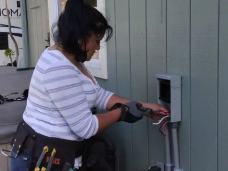 Licensed electrician wiring an exterior subpanel in Newburgh